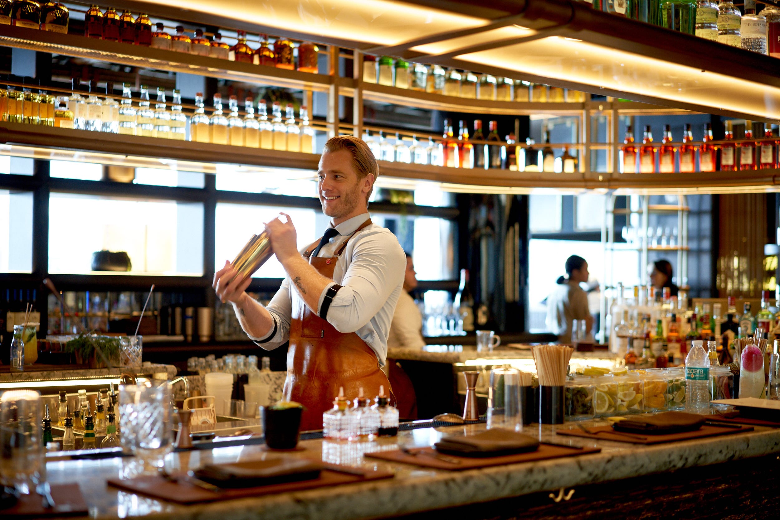 Wild ink bartender shaking a cocktail